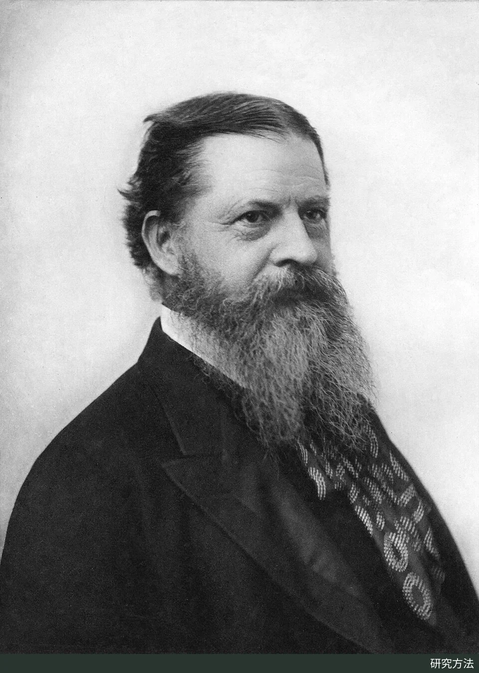 Black-and-white portrait photograph of Charles Sanders Peirce taken in 1891; he has a thick beard and wears a dark formal suit